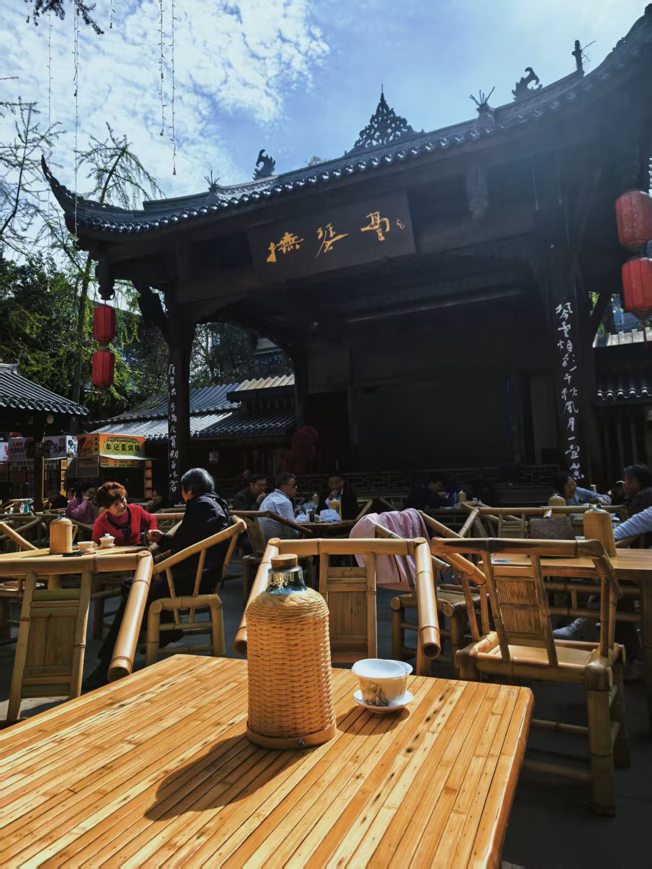 Bamboo chairs filling the courtyard in front of the stage